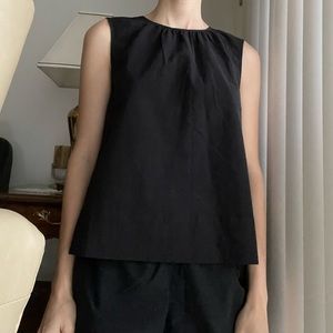 Cute black Everlane top with tie detailing in back.